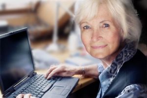 elderly woman at laptop