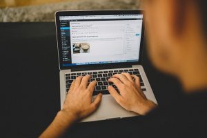 hands at laptop keyboard