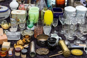 old glass collection on flea market table