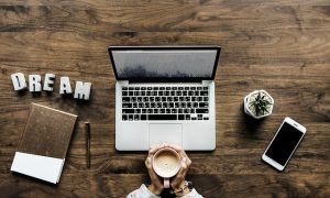 laptop on wooden table