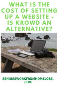 laptop on table by ocean